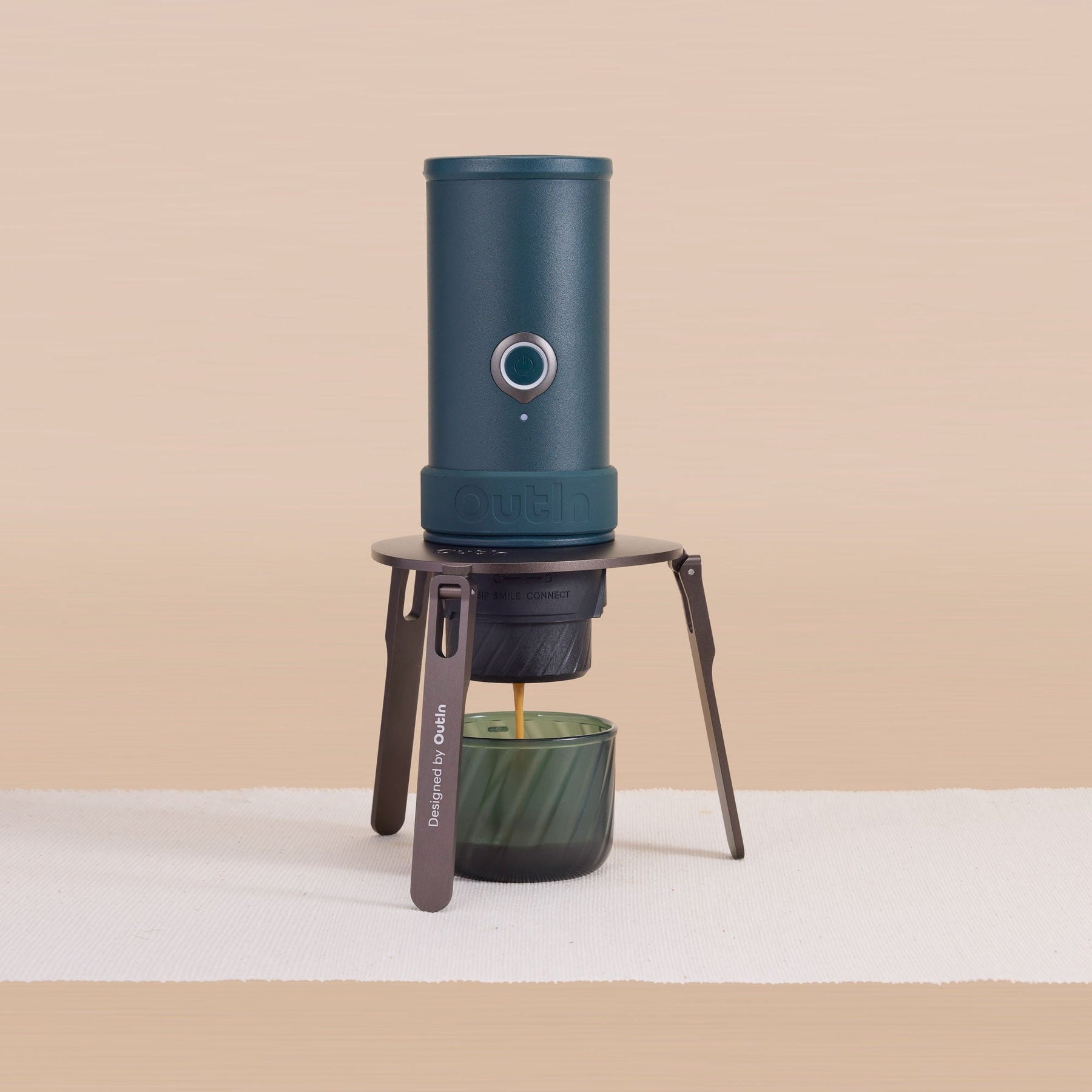 OutIn Foldable Coffee Stand supporting a portable coffee setup
